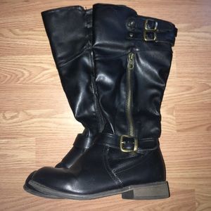 Black boots with gold accents.